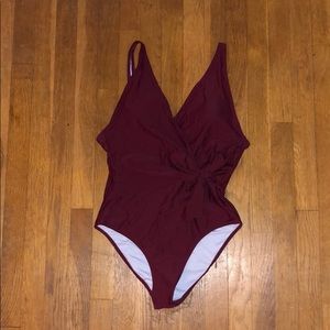 Burgundy one piece with a side bow